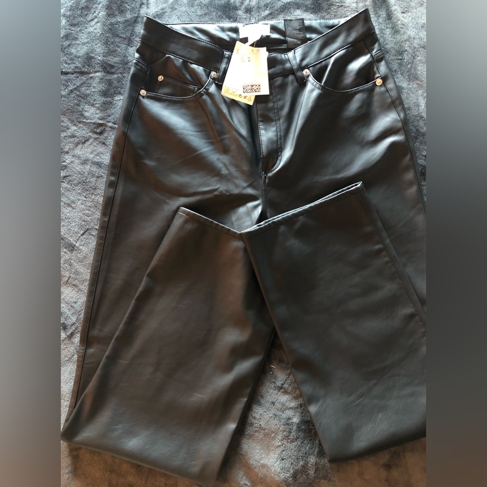 Black leather wide legged pants.